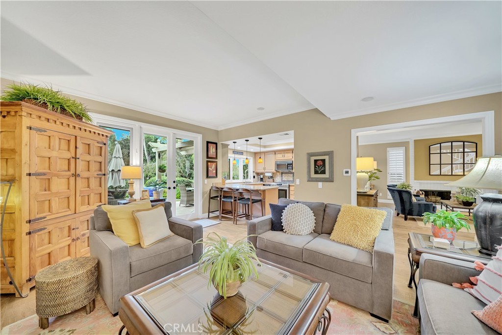 10 Crystal Pool, Unit 39 Irvine, CA 92603 - Photo 14 of 30 a living room with furniture and a wooden floor