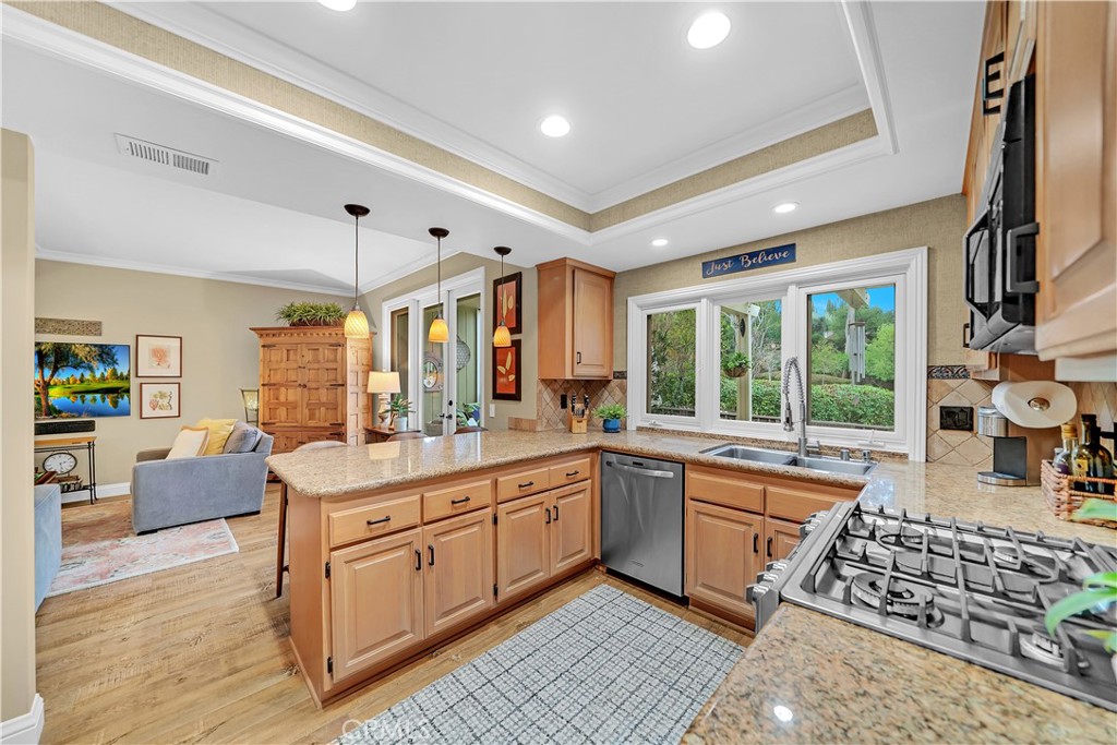 10 Crystal Pool, Unit 39 Irvine, CA 92603 - Photo 17 of 30 a large kitchen with stainless steel appliances granite countertop a stove and a sink