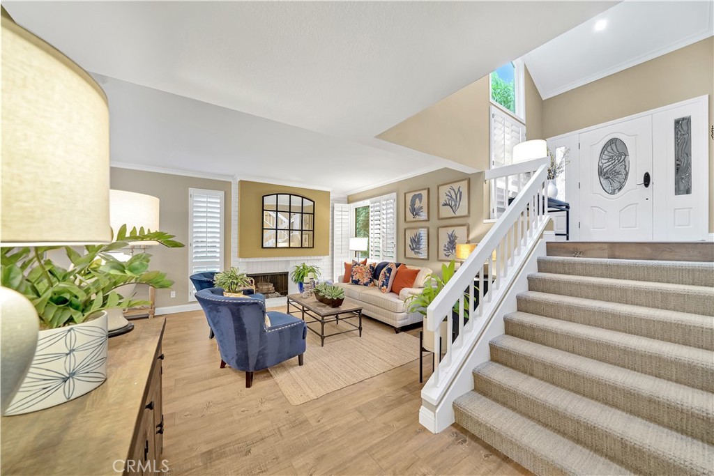 10 Crystal Pool, Unit 39 Irvine, CA 92603 - Photo 18 of 30 a living room with furniture and wooden floor