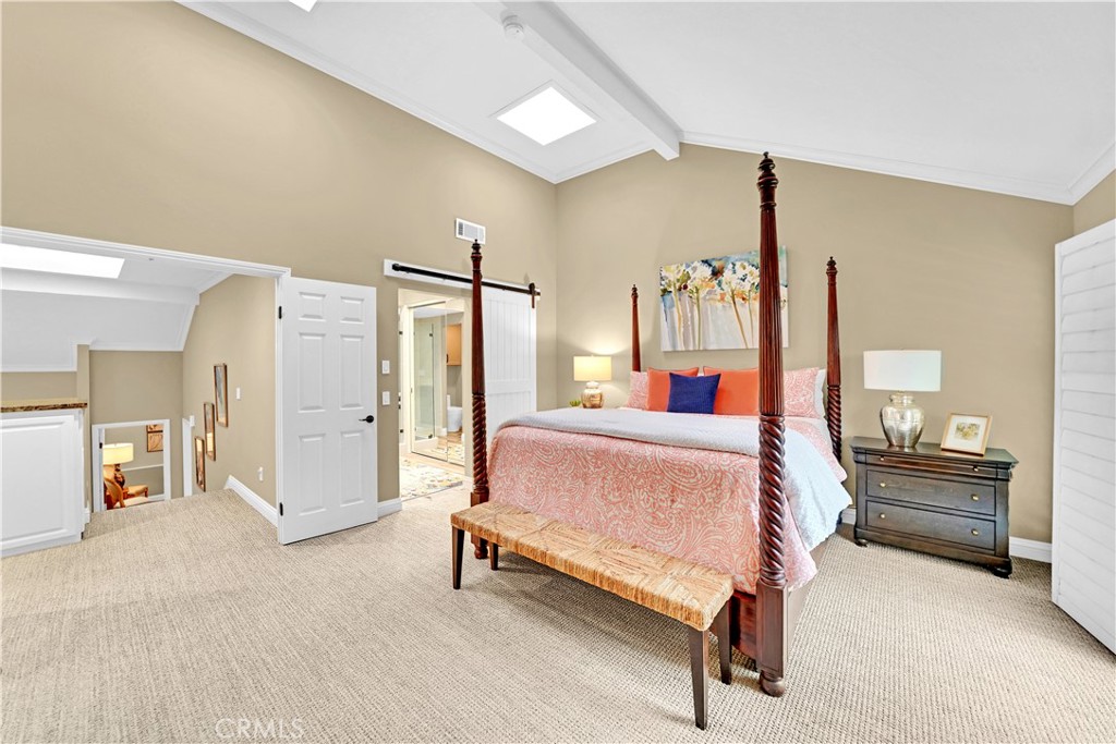 10 Crystal Pool, Unit 39 Irvine, CA 92603 - Photo 23 of 30 a bed room with a bed and a chair