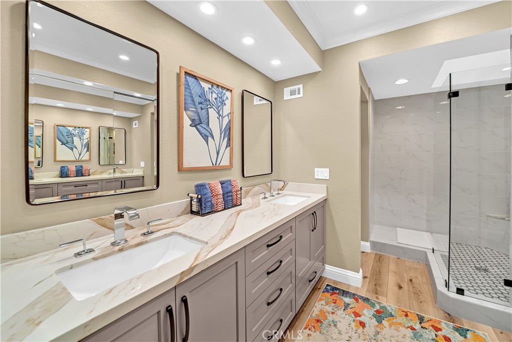 10 Crystal Pool, Unit 39 Irvine, CA 92603 - Photo 25 of 30 a bathroom with a double vanity sink mirror and double