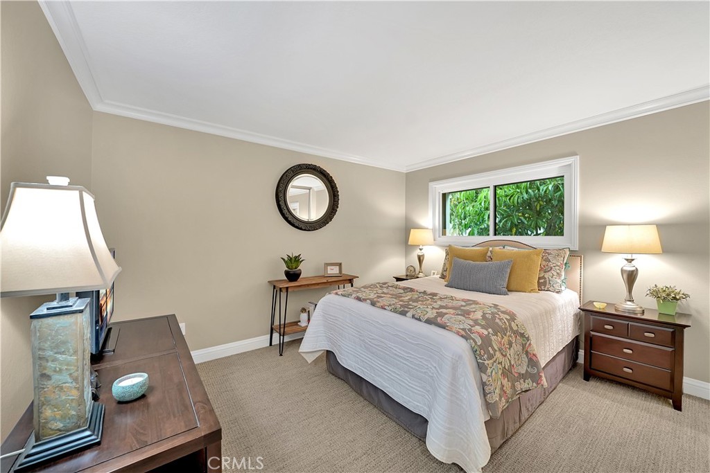 10 Crystal Pool, Unit 39 Irvine, CA 92603 - Photo 28 of 30 a bedroom with a bed and window