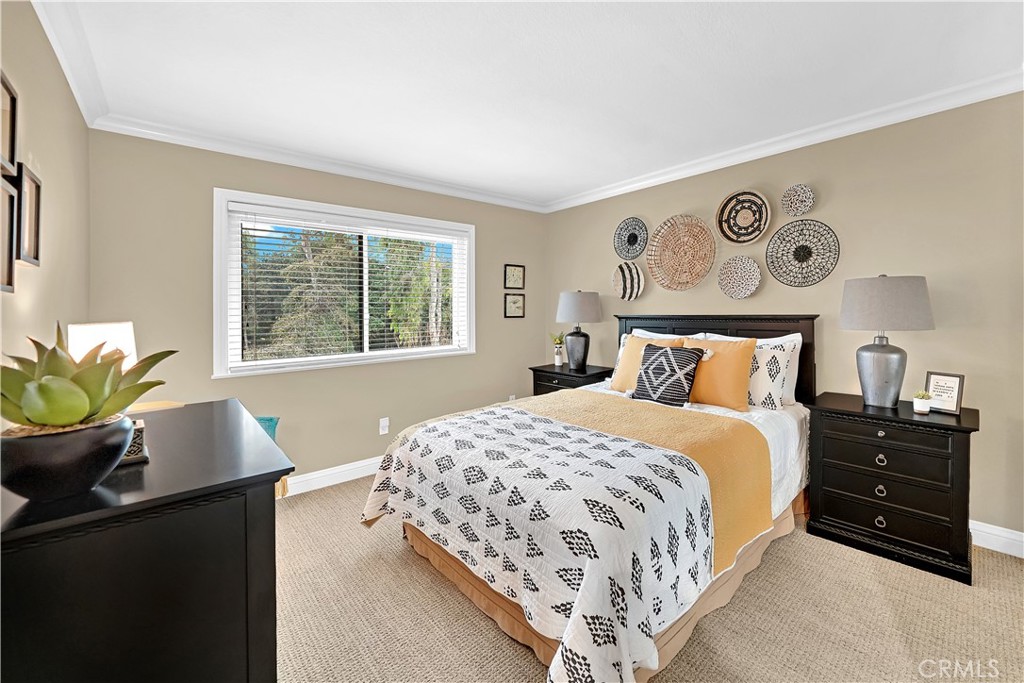 10 Crystal Pool, Unit 39 Irvine, CA 92603 - Photo 29 of 30 a bedroom with a bed and a dresser next to a window