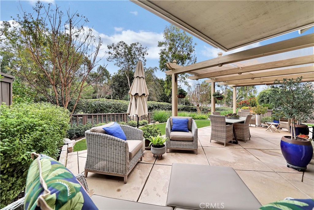 10 Crystal Pool, Unit 39 Irvine, CA 92603 - Photo 3 of 30 a patio view with patio couches coffee table and potted plants with sky view