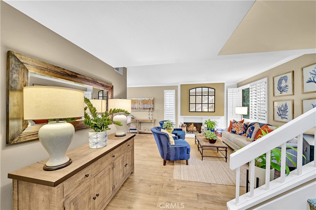 10 Crystal Pool, Unit 39 Irvine, CA 92603 - Photo 5 of 30 a living room with furniture large window and flat screen tv
