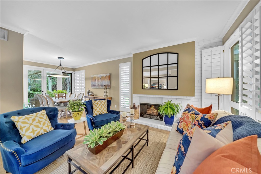 10 Crystal Pool, Unit 39 Irvine, CA 92603 - Photo 6 of 30 a living room with furniture and a large window