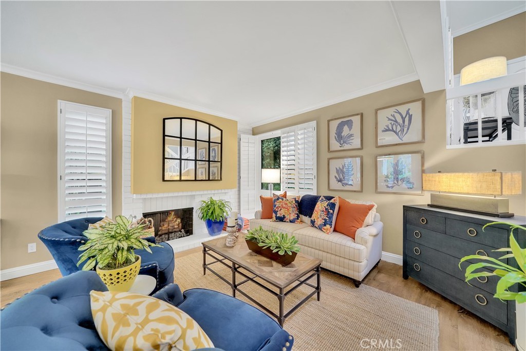 10 Crystal Pool, Unit 39 Irvine, CA 92603 - Photo 7 of 30 a living room with furniture and a potted plant