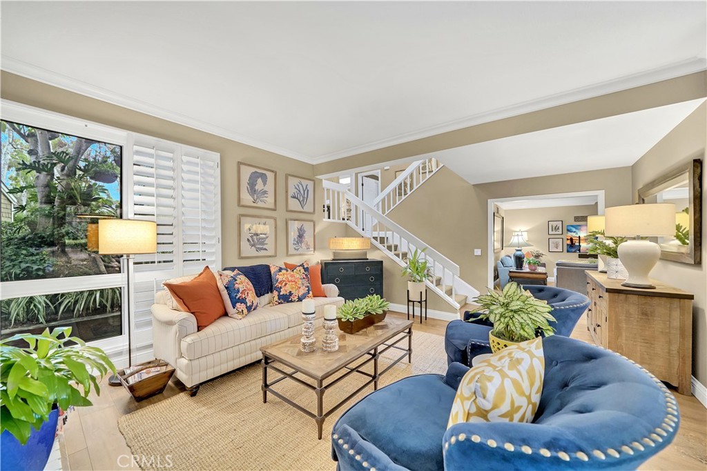 10 Crystal Pool, Unit 39 Irvine, CA 92603 - Photo 8 of 30 a living room with furniture and a potted plant