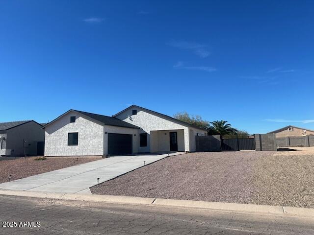 15988 South Yava Road Arizona City, AZ 85123 - Photo 1 of 21 a view of a white house with a yard
