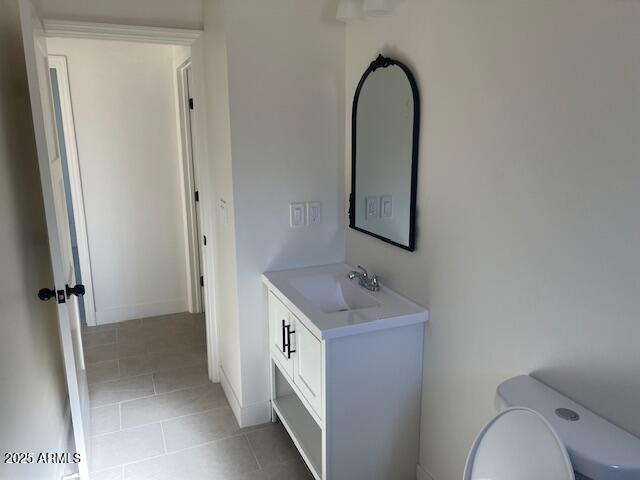 15988 South Yava Road Arizona City, AZ 85123 - Photo 16 of 21 a bathroom with a granite countertop sink a toilet and a mirror