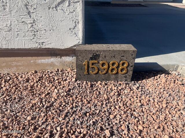 15988 South Yava Road Arizona City, AZ 85123 - Photo 3 of 21 a wooden door with a black and white wall
