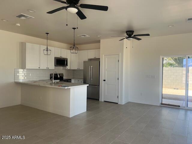 15988 South Yava Road Arizona City, AZ 85123 - Photo 6 of 21 a kitchen with stainless steel appliances a refrigerator sink and microwave