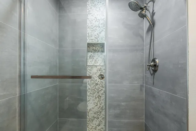 a view of washer and dryer with kitchen in the background