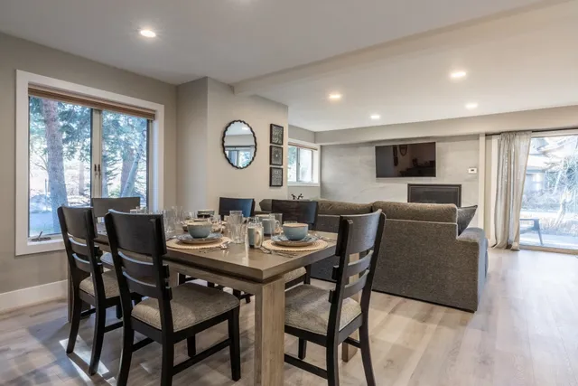 a view of a dining room with furniture and window