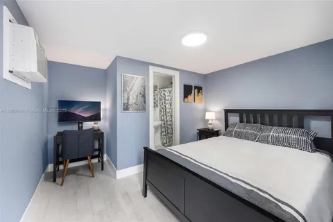 a bedroom with a bed and a chair