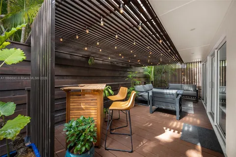 a outdoor living space with furniture and a potted plant