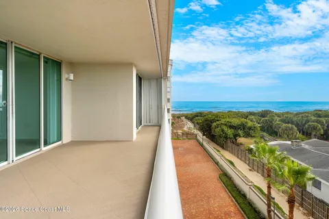 a view of balcony with furniture