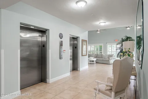 a view of a livingroom with furniture and a window
