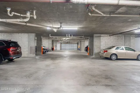 a view of parking garage with cars