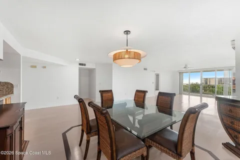 a view of a dining room with furniture wooden floor and chandelier