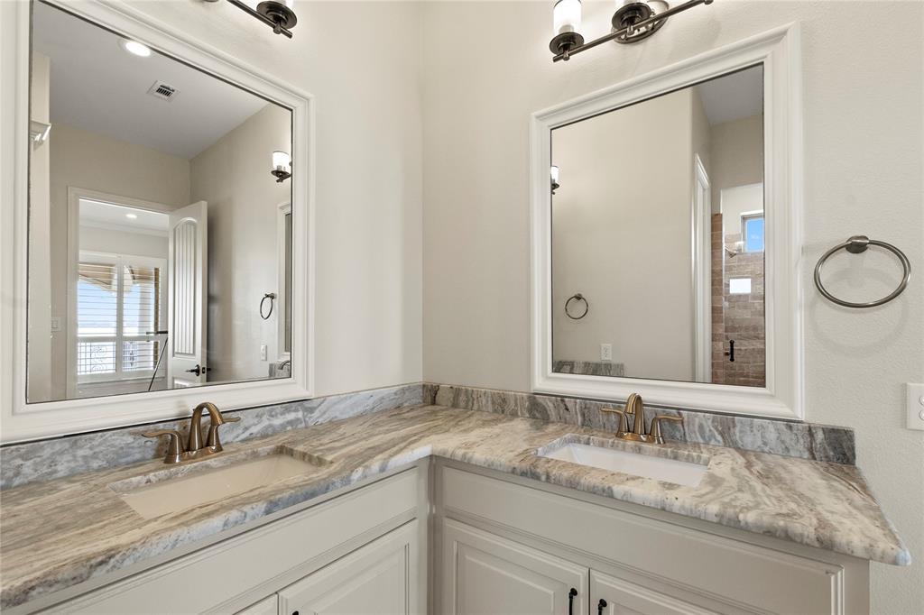 204 Pinnacle Club Place Mabank, TX 75156 - Photo 28 of 40 Ensuite bath with double sink vanity and walk in shower for bedroom 3