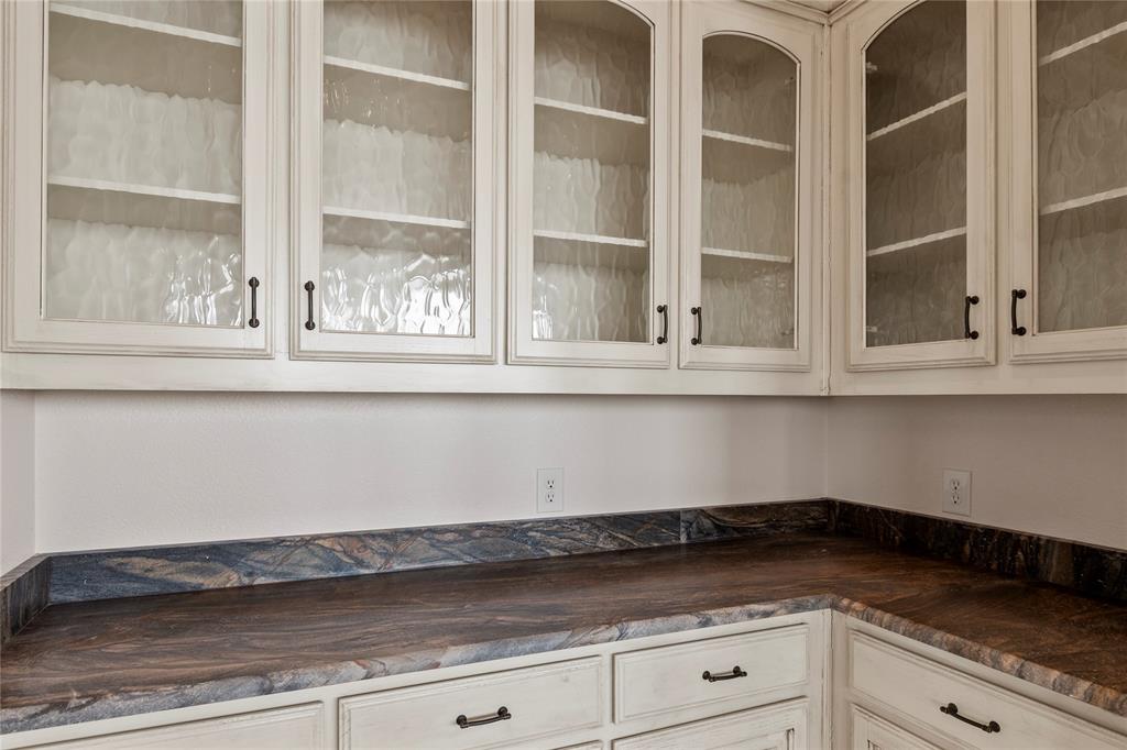 204 Pinnacle Club Place Mabank, TX 75156 - Photo 8 of 40 Butlers pantry conveniently located next to the kitchen and dining areas.