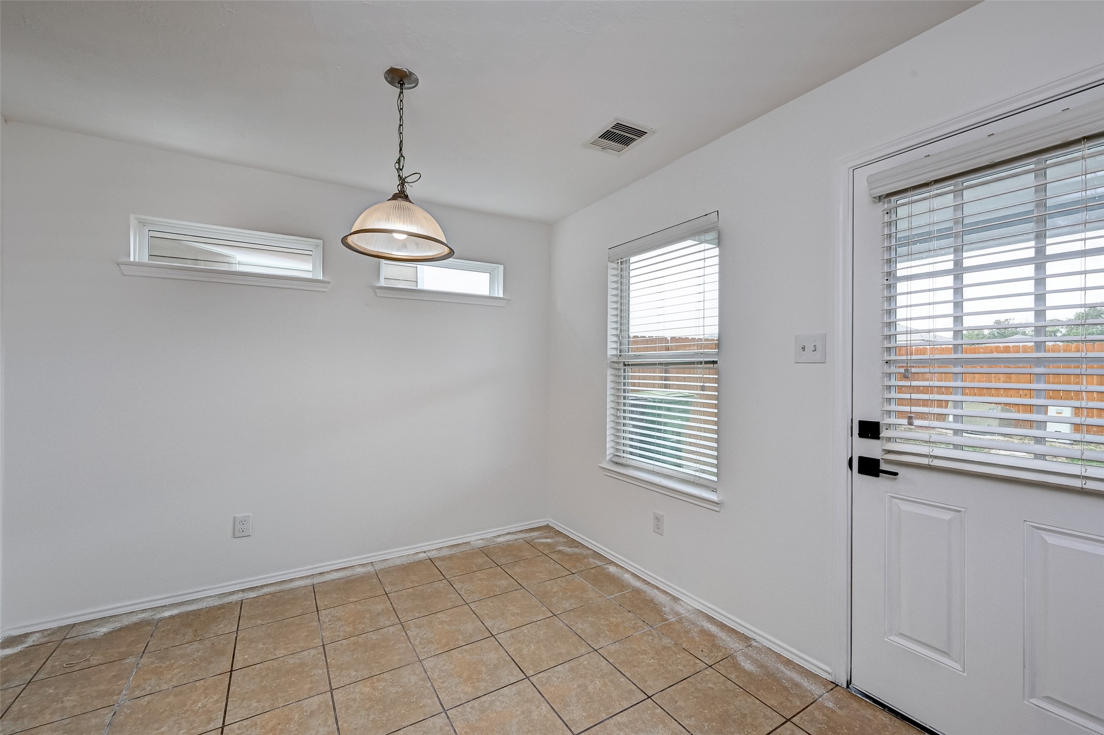 6906 Anson Point Lane Houston, TX 77040 - Photo 9 of 31 a view of a room with window and white walls