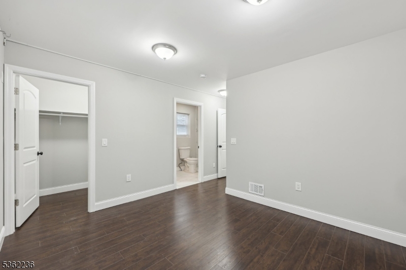 253 North 4th Street Paterson, NJ 07522 - Photo 11 of 15 a view of an empty room with wooden floor
