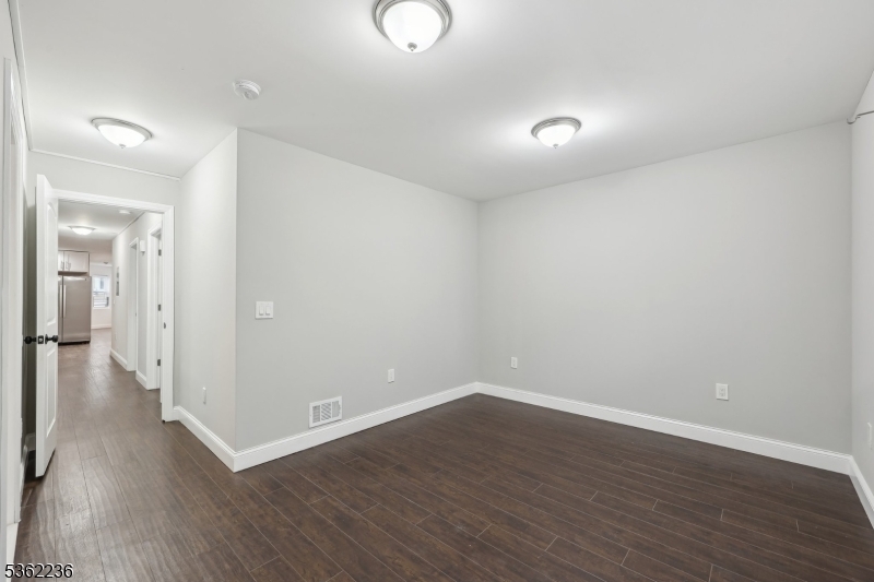 253 North 4th Street Paterson, NJ 07522 - Photo 12 of 15 a view of a room with wooden floor