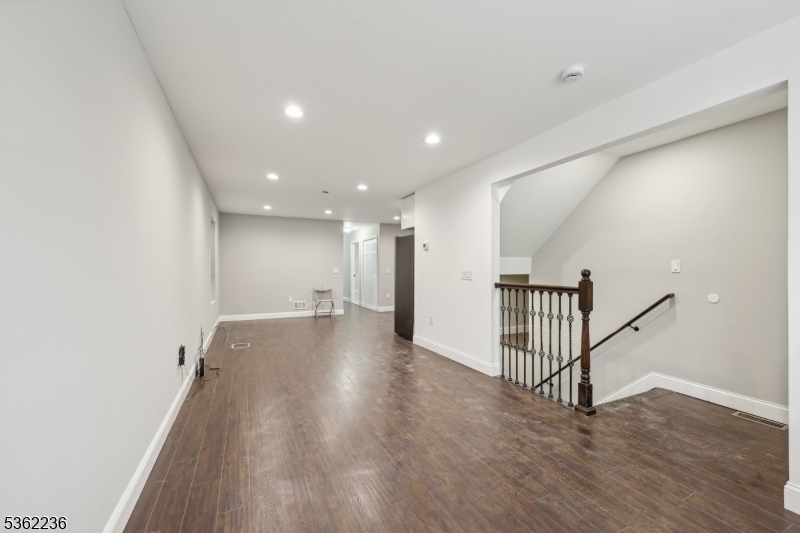 253 North 4th Street Paterson, NJ 07522 - Photo 2 of 15 a view of a hallway with wooden floor