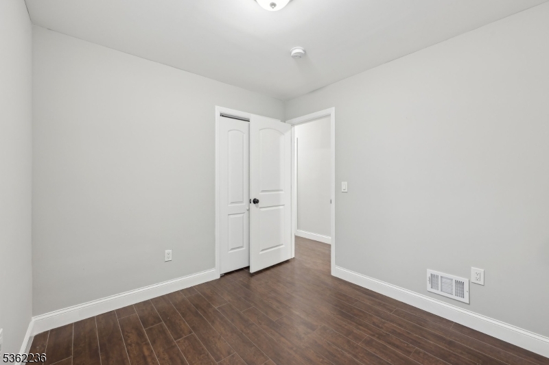 253 North 4th Street Paterson, NJ 07522 - Photo 8 of 15 a view of an empty room and wooden floor