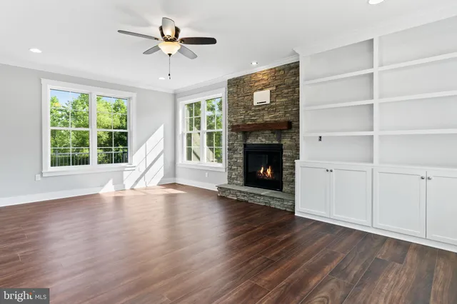 a view of an entryway with wooden floor and stairs