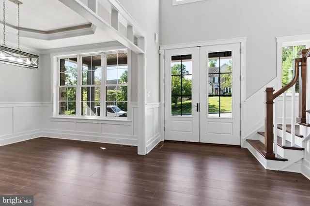 a view of an entryway with wooden floor