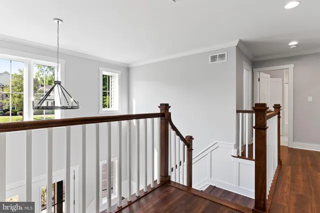 a view of an entryway with wooden floor