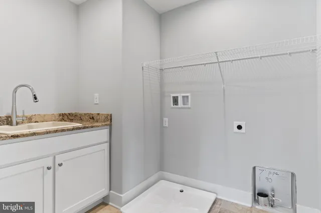 an empty room with a window and a ceiling fan