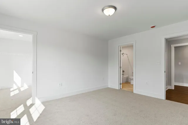 a view of a room with wooden floor