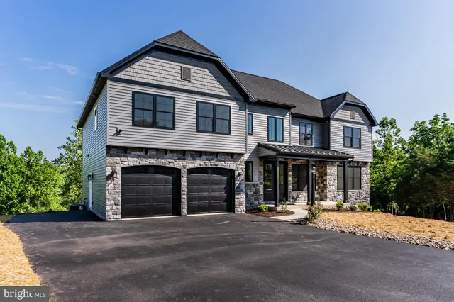 a front view of a house with yard