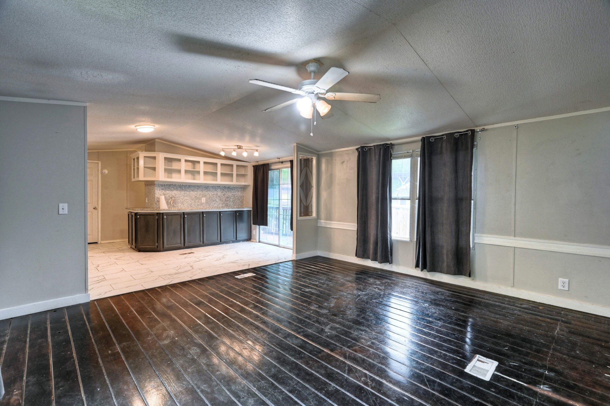 13204 Enchanted Vista Willis, TX 77318 - Photo 11 of 43 a view of an empty room with window and wooden floor
