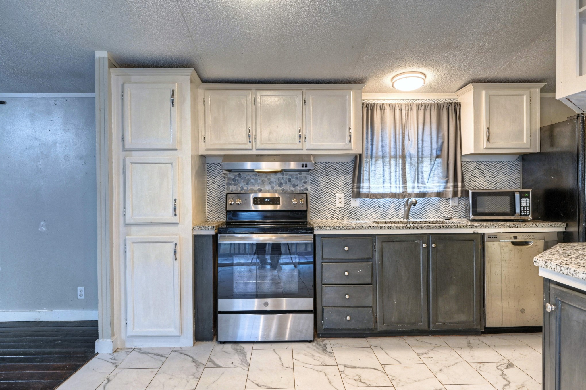 13204 Enchanted Vista Willis, TX 77318 - Photo 15 of 43 a kitchen with a refrigerator sink and cabinets