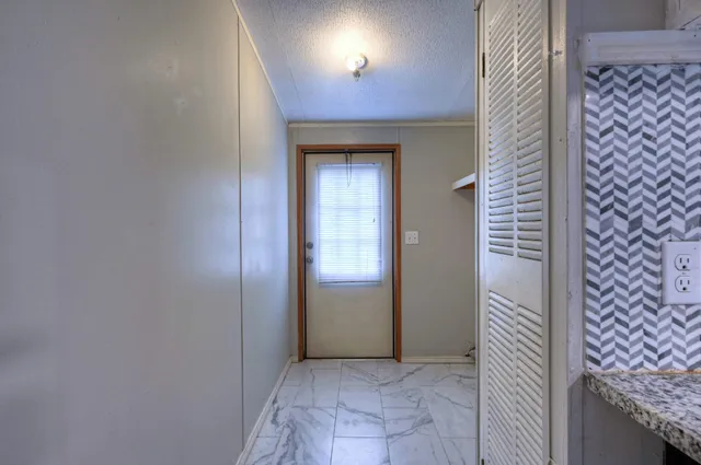 an empty room that has a mirror in it