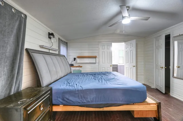 a bedroom with a bed and window