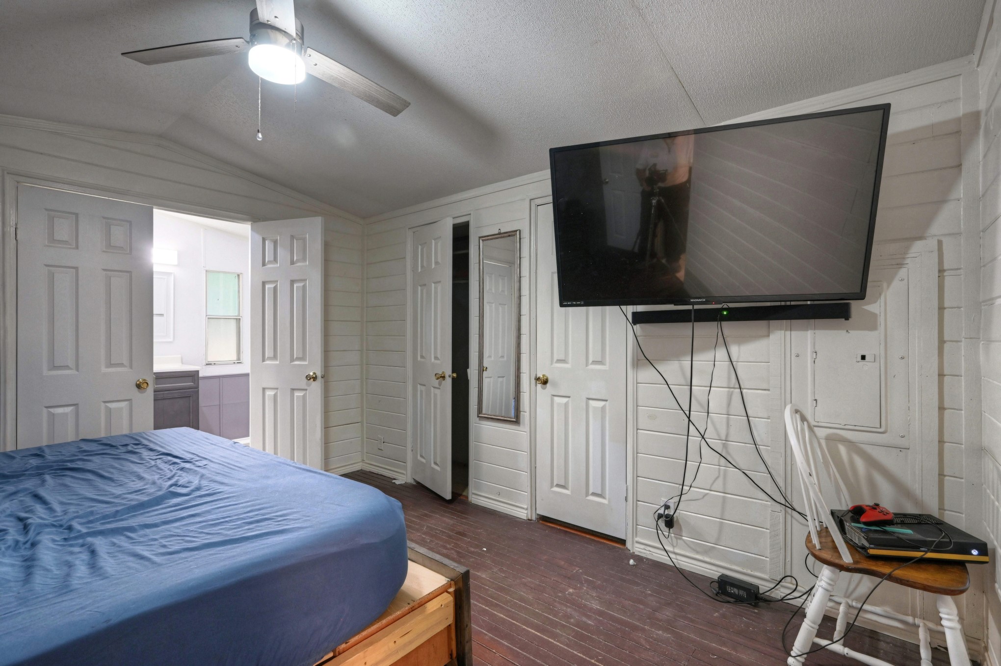 13204 Enchanted Vista Willis, TX 77318 - Photo 25 of 43 a bedroom with a bed and wooden floor