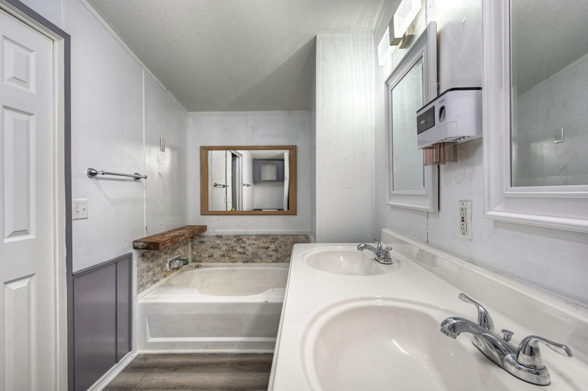 13204 Enchanted Vista Willis, TX 77318 - Photo 27 of 43 a bathroom with a tub sink and mirror