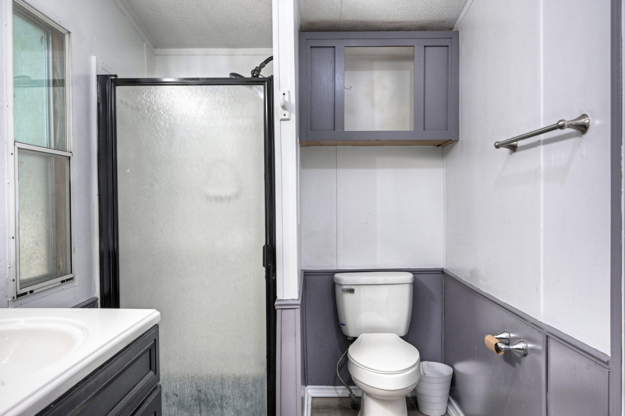 13204 Enchanted Vista Willis, TX 77318 - Photo 29 of 43 a bathroom with a granite countertop sink toilet and shower