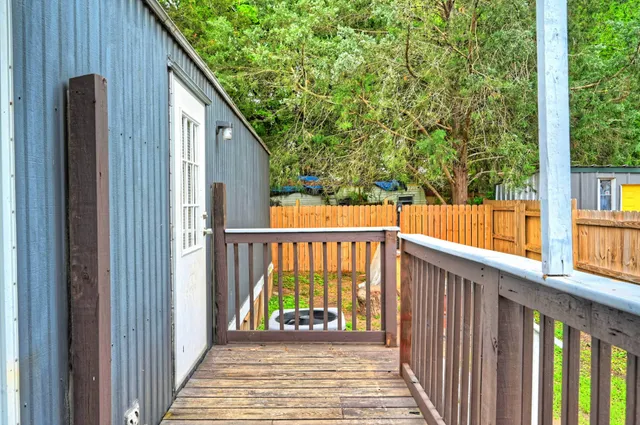 a view of a balcony with wooden floor