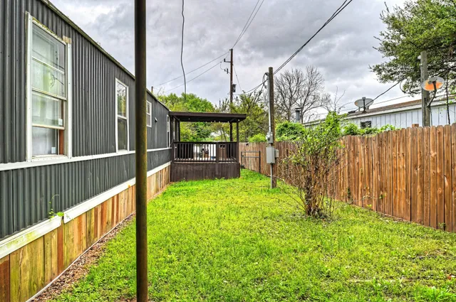 a view of backyard with green space