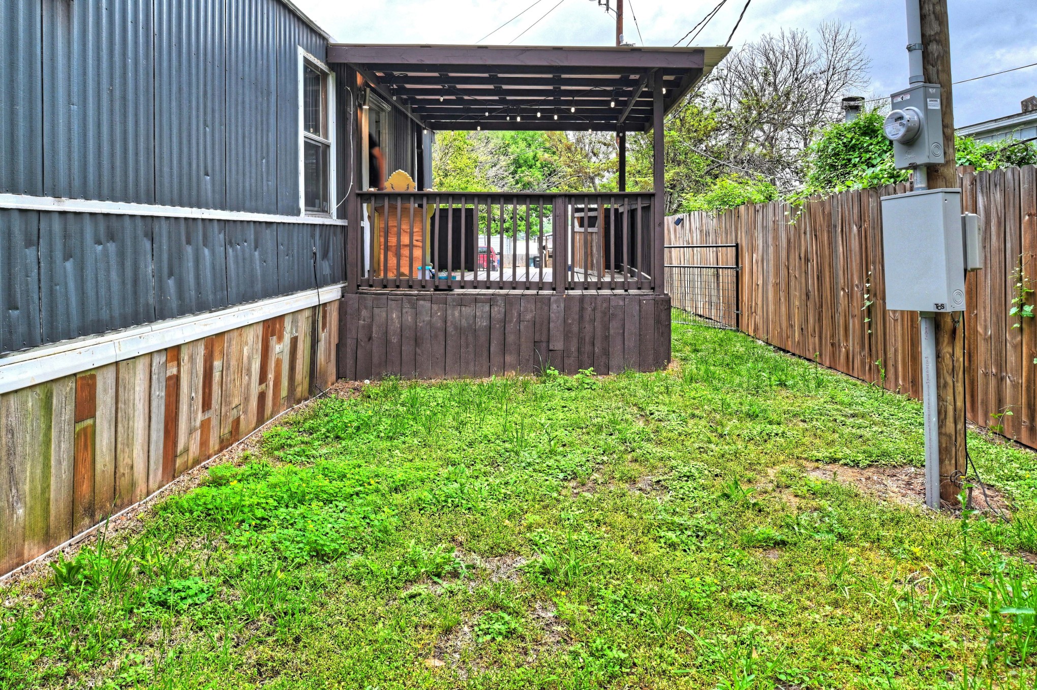 13204 Enchanted Vista Willis, TX 77318 - Photo 9 of 43 a view of backyard with large trees and wooden fence
