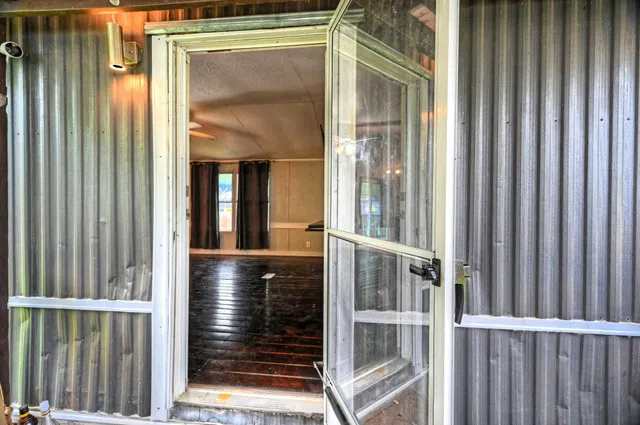 a view of outdoor space with wooden floor