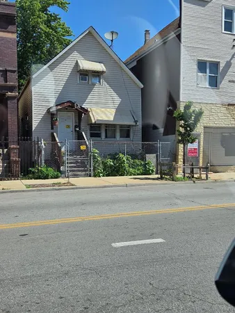 front view of a house with a street