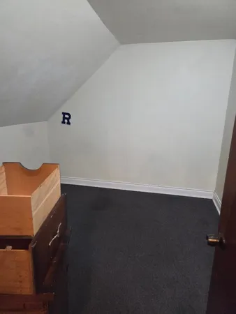 an empty room with wooden floor